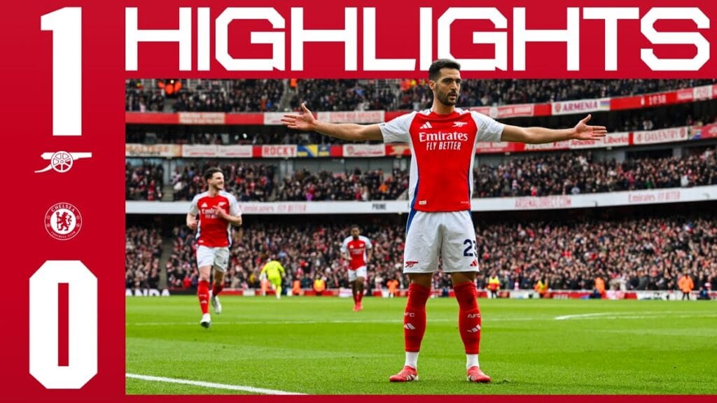 Arsenal players celebrate after scoring the winning goal against Chelsea in a tense London derby.
