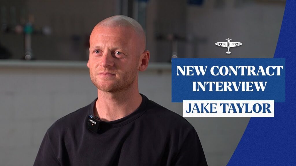 Eastleigh FC captain Jake Taylor smiles after signing a new contract for the 2025 season.
